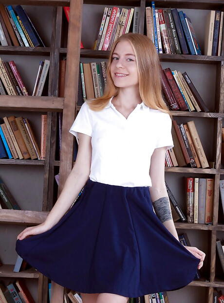 Foxy blonde young Chloe revealing tiny tits and spreading her legs 