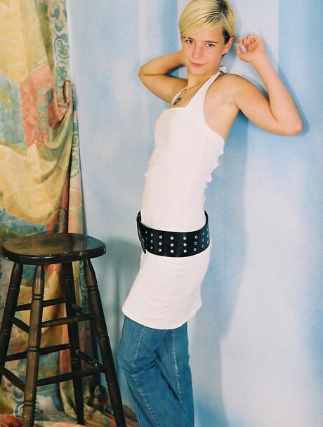 Gracile young Shelly exposes small tits and vagina 